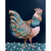 Painting of a chicken with pink, blue, turquoise, and caramel feathers. It stands on blue-green grass full of white flowers.