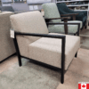 light grey accent chair with slim black metal arms.