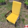 Gold velvet high back dining chair with wood arms and legs stained espresso.