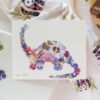 an art print of a brontosaurus made from pressed florals.