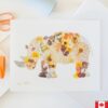 art print of a rhinoceros made from pressed florals.