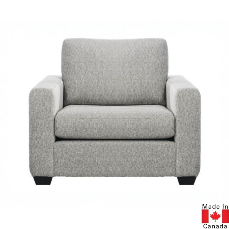 Light grey upholstered chair. Boxy shape.