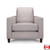 Light grey accent chair with a boxy shape. On medium height dark wood legs.