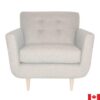 Light grey upholstered chair with 4 buttons on the tight back, and light wood cone shaped legs.