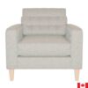 Light grey armchair with button tufted back, and light wood legs.