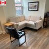 Cream sectional sofa. Boxy shape, small size.