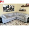 Light grey sectional sofa with deep seats. Boxy shape.