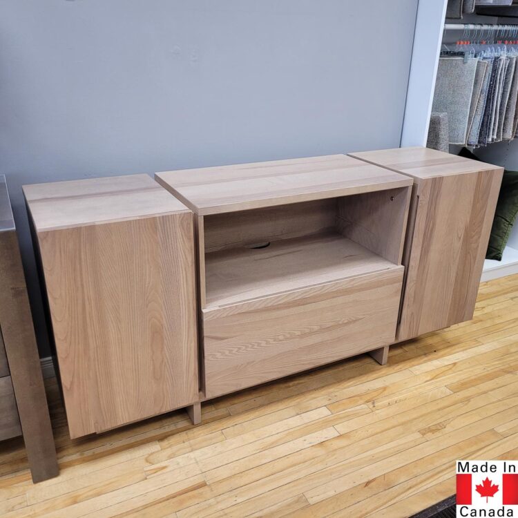Light wood buffet with one door on each end. One large centre drawer with an open space above.