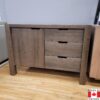 Medium brown wood buffet. 3 drawers, plus one door with an adjustable shelf behind.