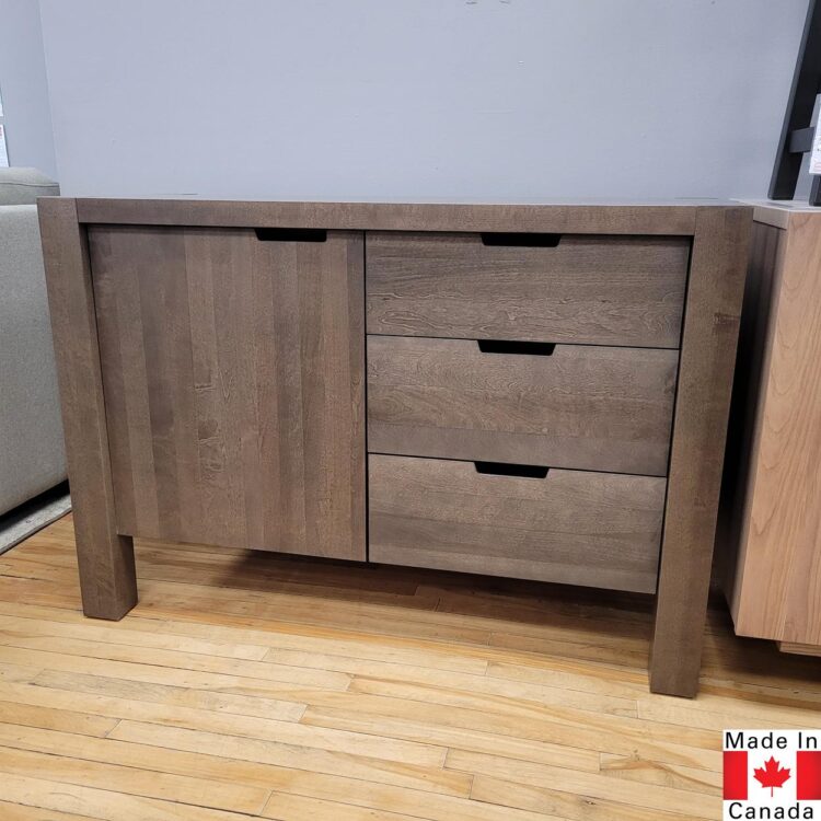 Medium brown wood buffet. 3 drawers, plus one door with an adjustable shelf behind.